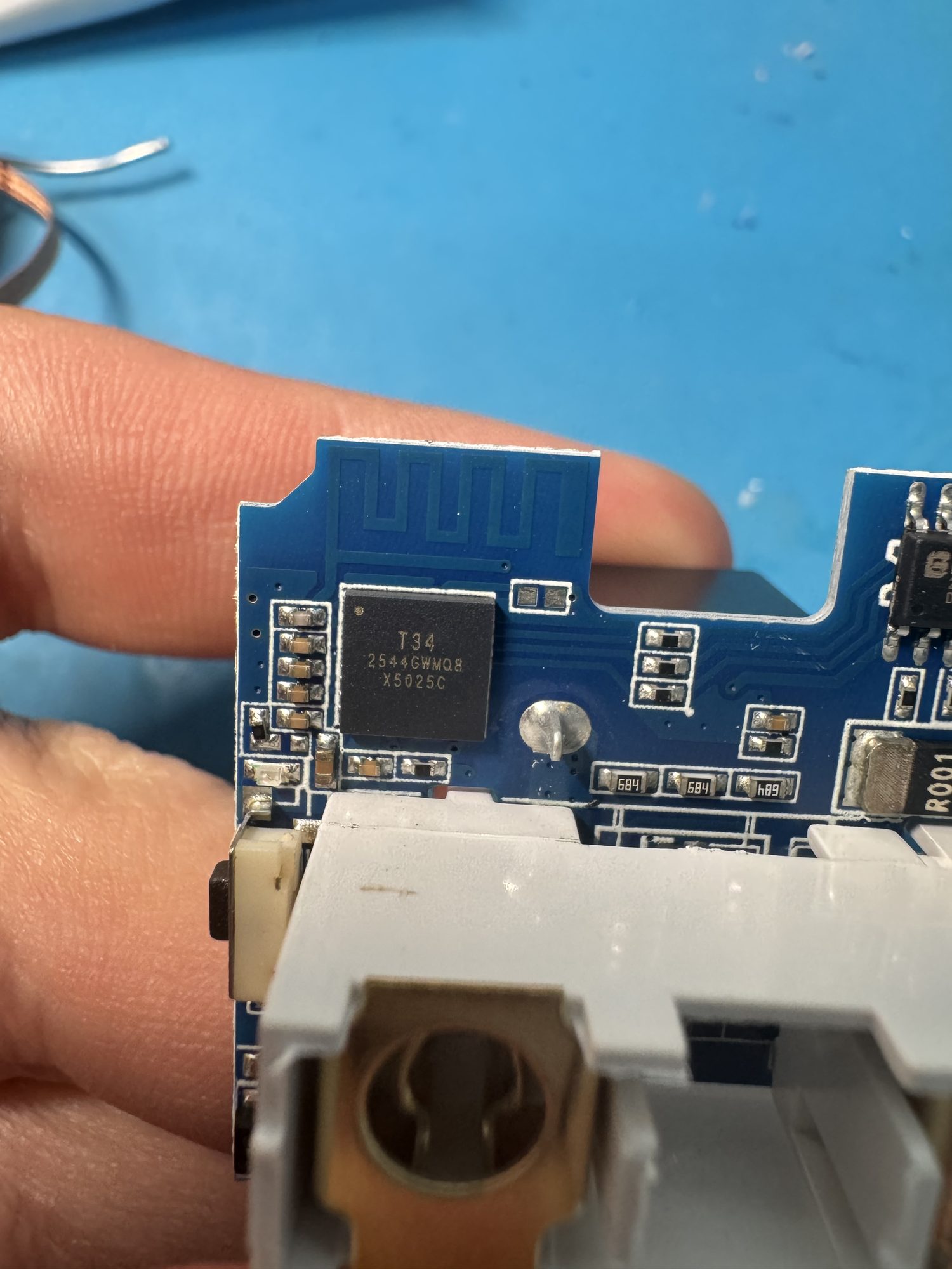 The T34 module: a Beken BK7231N Wi-Fi SoC. The same board, with the same silicon and the same power-monitoring chip, ships under at least four different brand names.